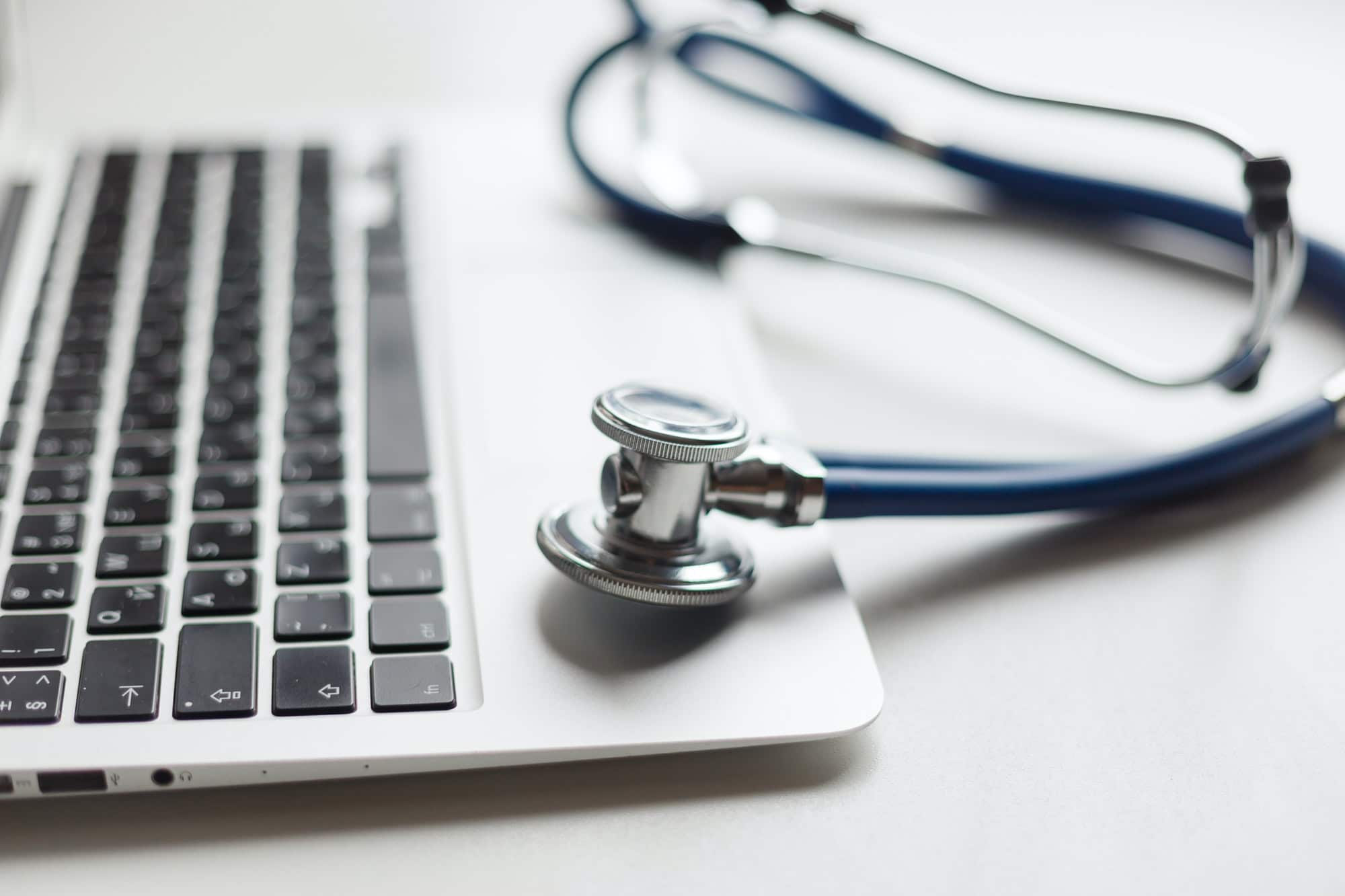 Stethoscope on the laptop keyboard. Medicine concept.